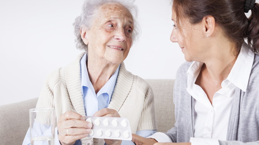 pharmacist with elderly patient