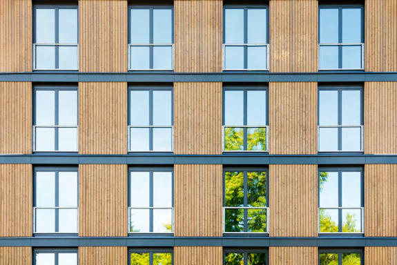 Apartment building with a wood facade. 