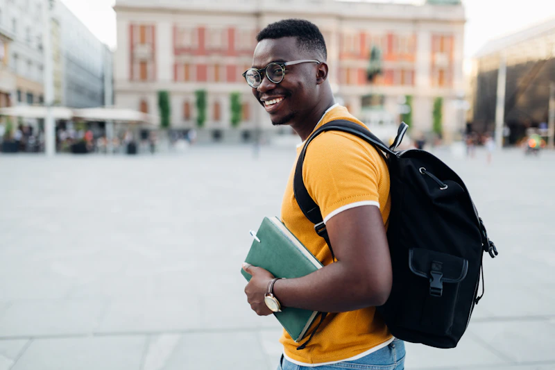 A student stands looking over the Barcelona skyline