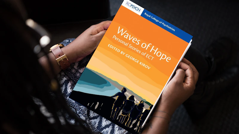 A person holds Waves of Hope book in their lap