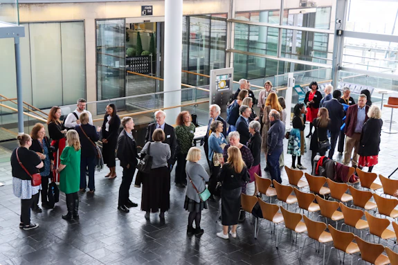 Attendees of the SURE event gathered in the Senedd foyer