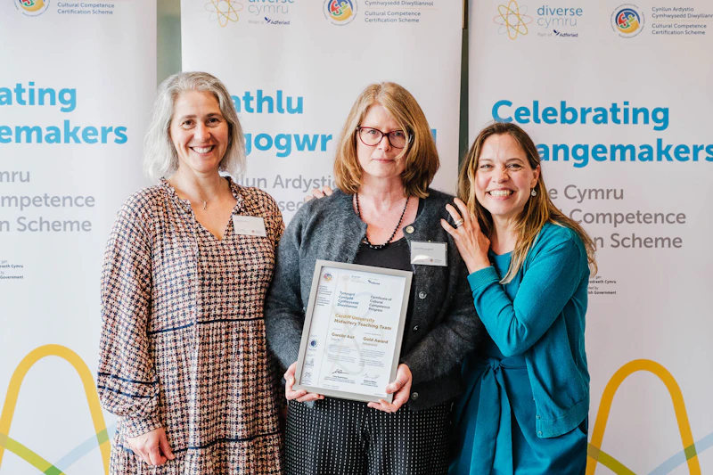 Professor Kate Button, Head of Cardiff University's School of Healthcare Sciences, Sian McLaughlin, Midwifery Programme Lead and Dr Lucie Warren, Lead Midwife for Education accepting the award.