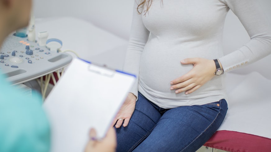 Pregnant woman in consultation with doctor