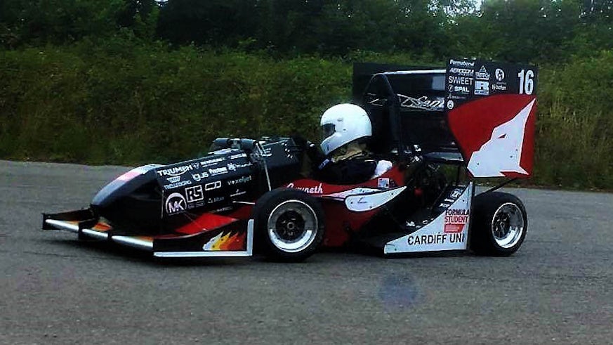 A student driving the Formula Student car