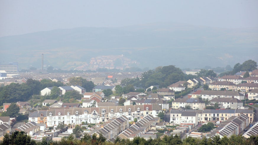 A view across the roofs of a Valleys town through the haze