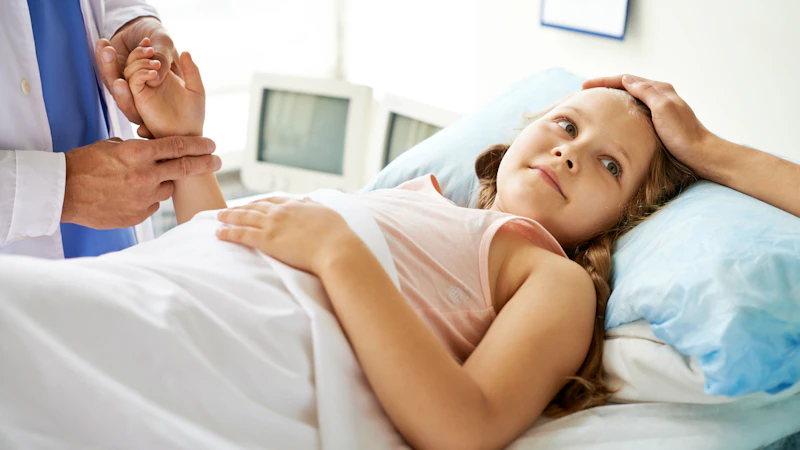 Doctor holding child hand