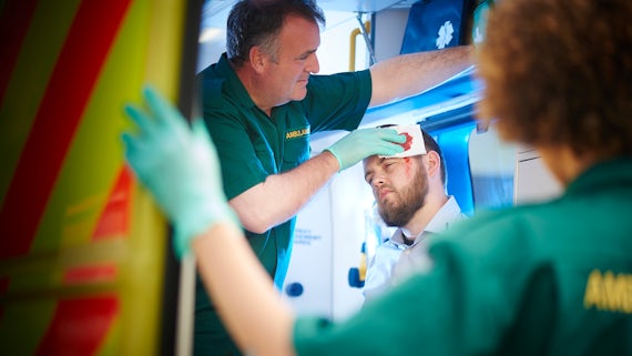Stock image of paramedic caring for patient