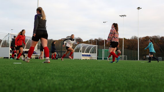 Cardiff University Ladies Football warming up on the brand new Tier-2 3G football facility
