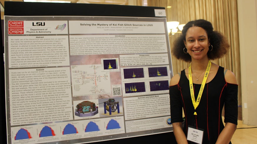 A female student poses for a photograph next to her research poster entitled ‘Solving the Mystery of Koi Fish Glitch Sources in LIGO’.