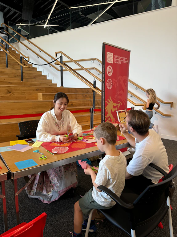 Children trying papercutting at Techniquest