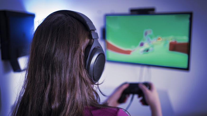 Young woman playing video game