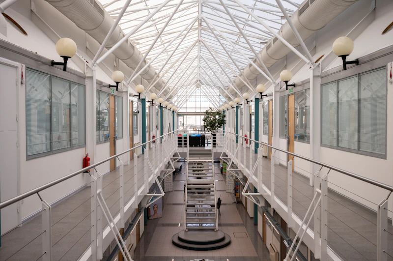 A view taken of the central stairs and balcony with units within Medicentre