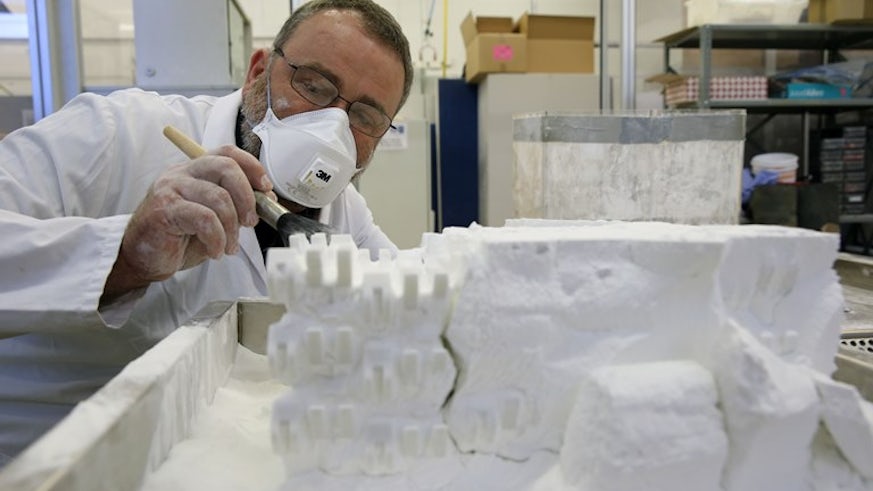 A technician working in the Additive Manufacturing Laboratory
