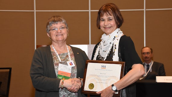 Emeritus Professor Miranda Aldhouse-Green receives her award at the Society for American Archaeology Awards on 8 April in Orlando.