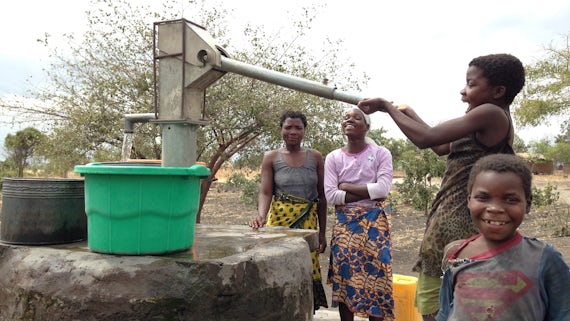 Villagers pumping water from a borehole in southern Malawi