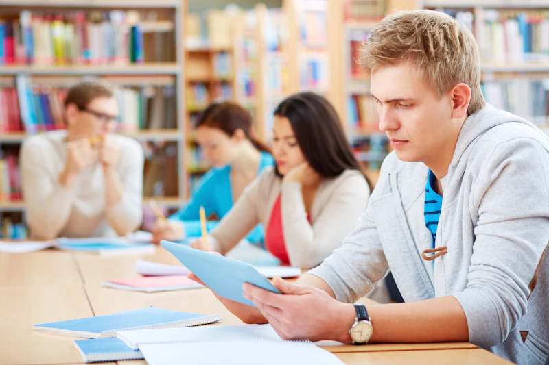 Medical Trainees sat at desk with ipad