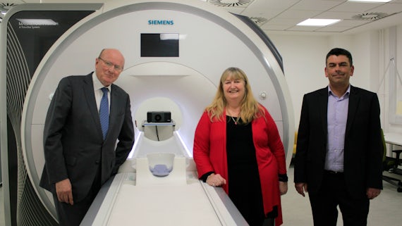 Julie James AM, Professor Derek Jones and Professor Krish Singh with MRI scanner