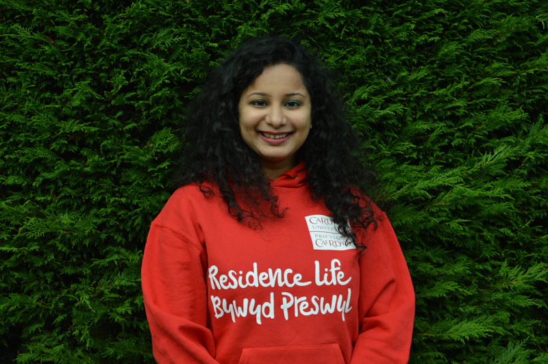 Student wearing a Residence Life hoody