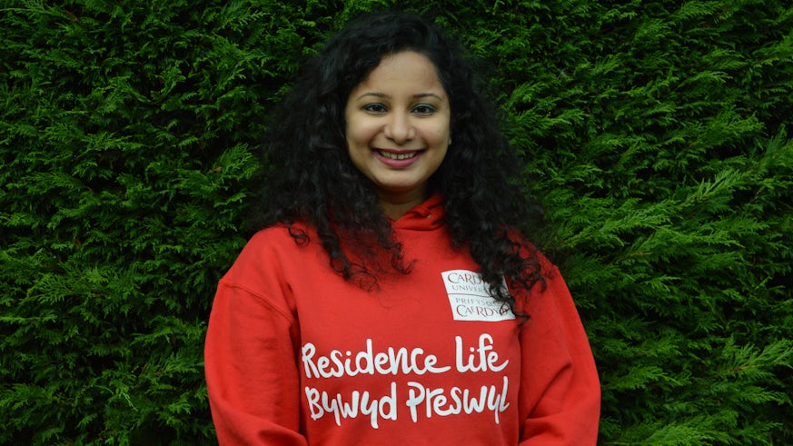 Student wearing a Residence Life hoody