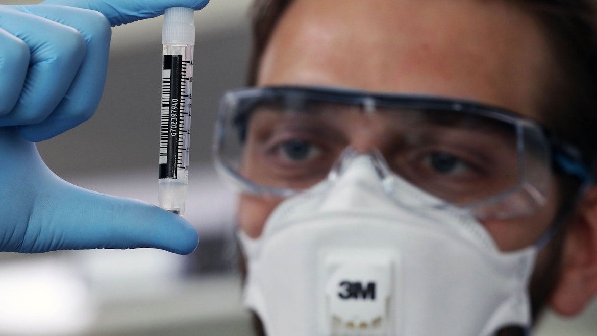 Man looking at a sample