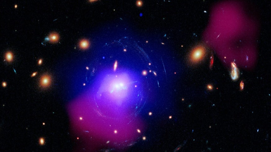 A composite image of multiple observations of a massive galaxy cluster 3.8 billion light-years from Earth taken from space and ground-based telescopes
