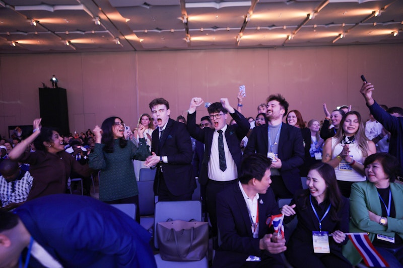 Students celebrating in the crowd at a competition 