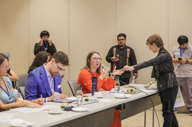 A panel of judges are photographed at a competition