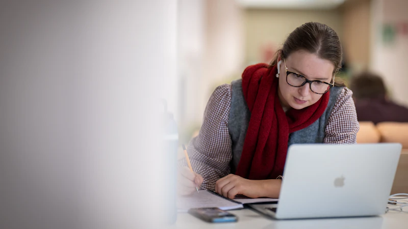 Female student working at laptop