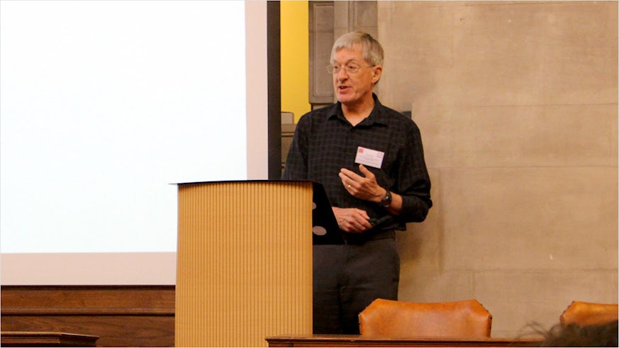 Professor Chris Pountain speaking at a lectern