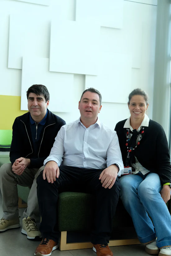Two men and one woman sat in the reception of the Cardiff University Brain Research Centre