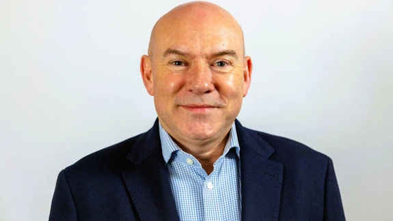 A portrait of a man wearing a suit.