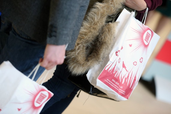 Hands gripping Cardiff University Open Day bags