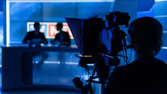 News readers in TV studio