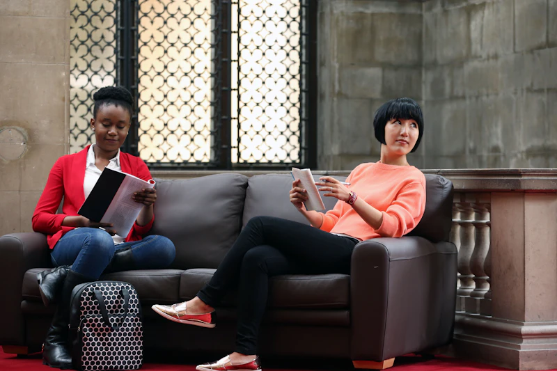 Postgraduate students on sofa