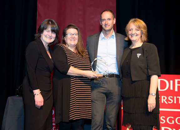 The Phoenix Project team receiving an award