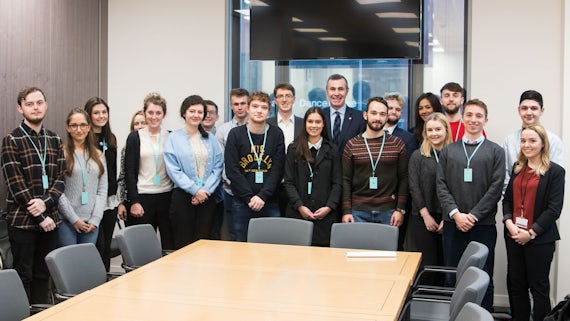 Dr Einion Dafydd and students with Adam Price AM during a visit to the Senedd. 