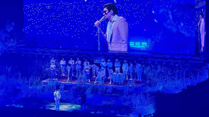 Bad Bunny performing on stage with a live band
