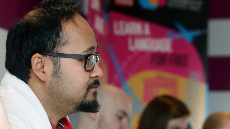 Man in profile with banners behind him