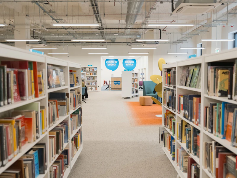 Bookshelves on either side of a row in a library.