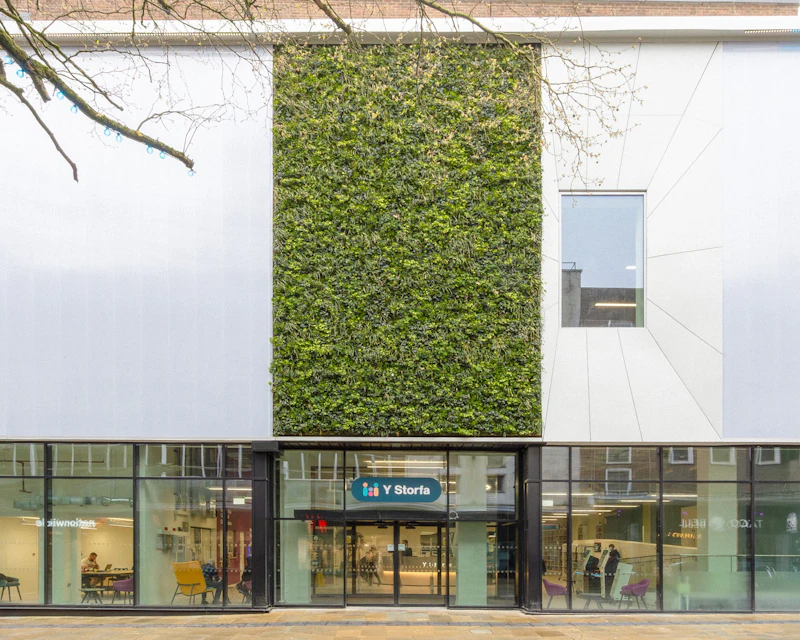 Wide shot of the exterior entrance of a modern building.