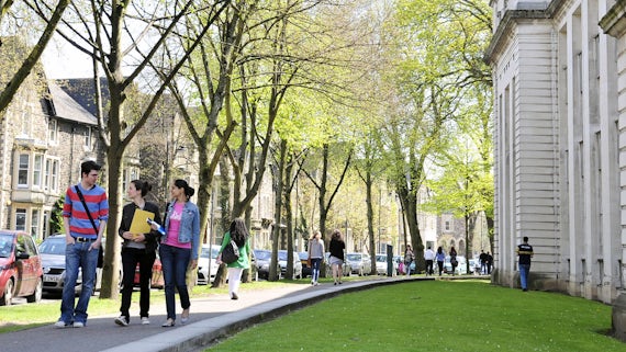 Students walking along Park Place in the middle of the Cathays Park campus.