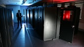 Man inspecting of supercomputers