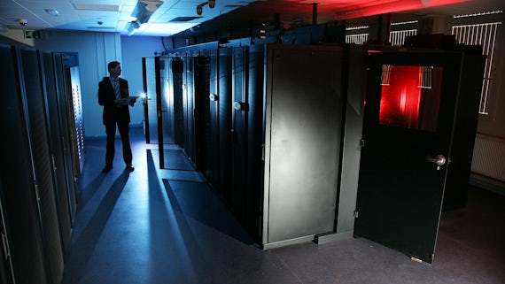 Man inspecting of supercomputers