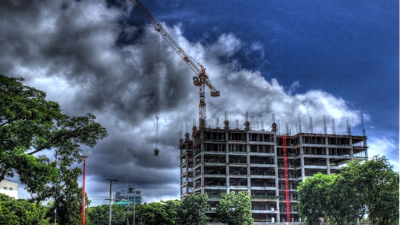 a half-constructed building and a crane