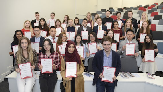 Group of students with certificates