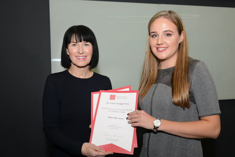 Female student with two awards