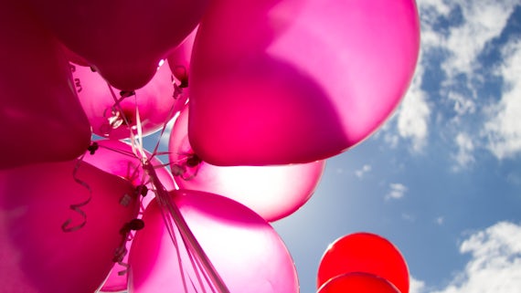 Pink balloons in the sky