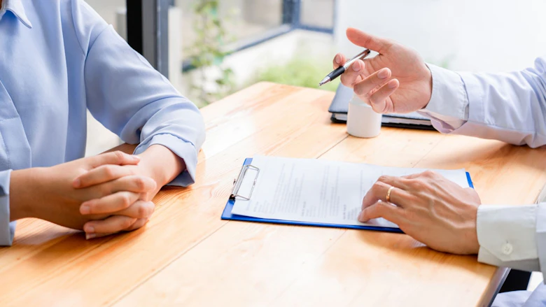 patient filling out form with dr