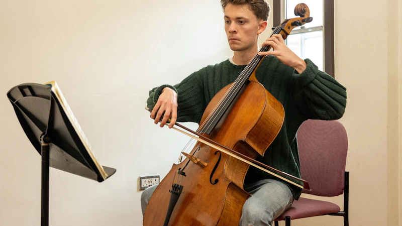 Image of a musician practicing the cello