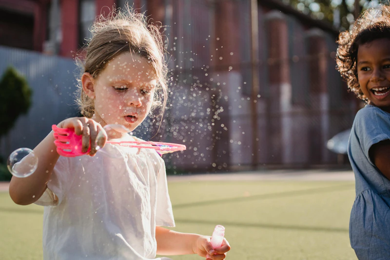 Children blowing bubbles